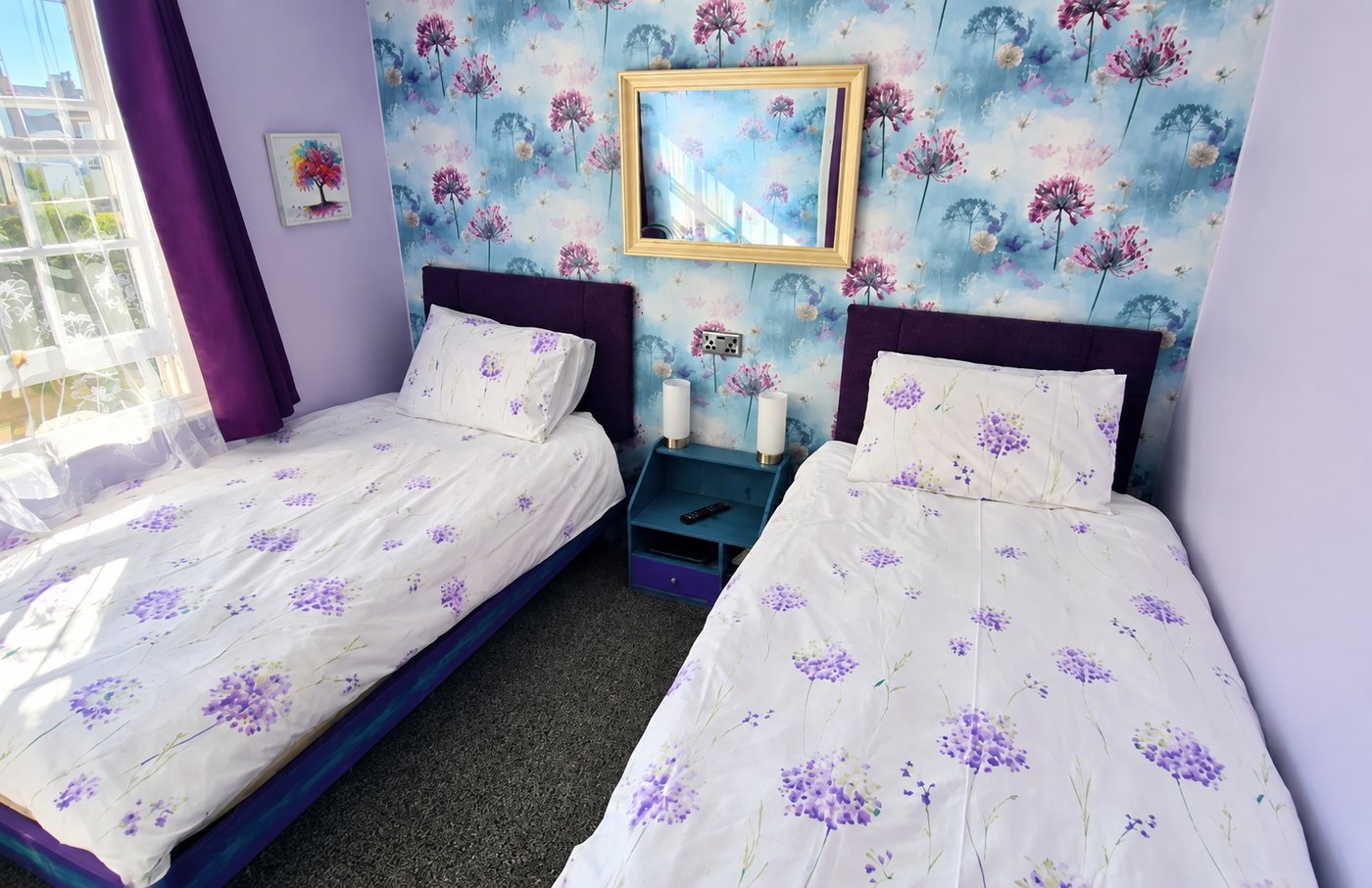 Twin room with floral wallpaper at Philbeach Guest House